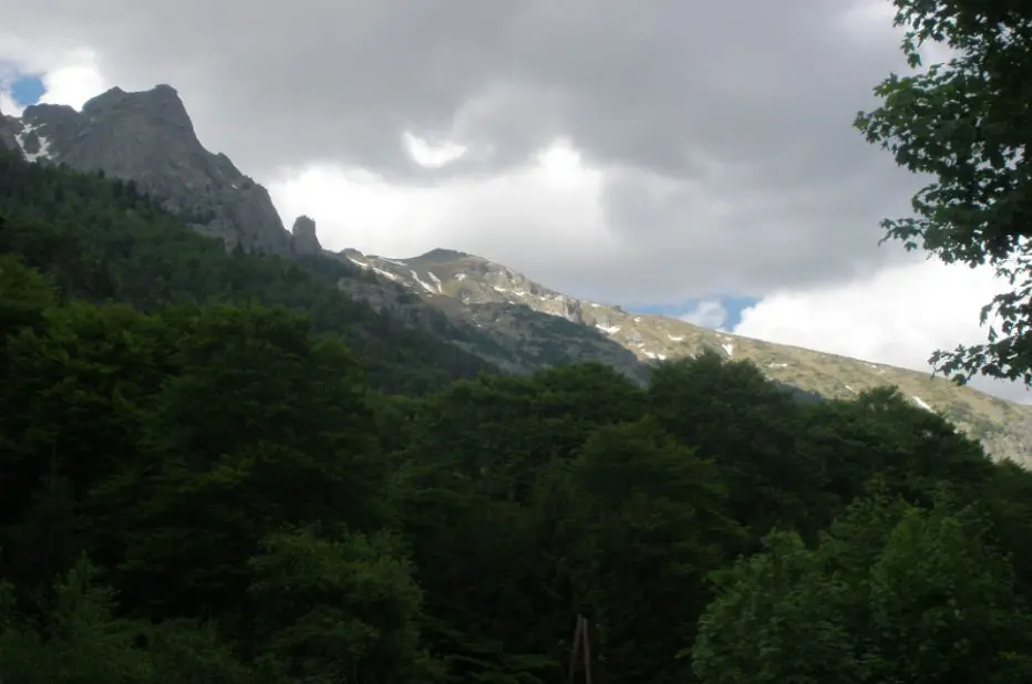 Photo source: bg.wikipedia.org  If you love nature and dream of admiring the views of ancient forests, snow-capped peaks and endless blue lakes, we offer you a short trip to one of the most beautiful lakes in our country - Elenino Lake. Where is? Elenino Lake is located in the Rila Mountains and is the largest of the three lakes that form a lake group called Elena Lakes.  The lake is located at 2479 meters above sea level, and in its waters are reflected four of the most beautiful peaks in Rila - Orlovets, Malyovitsa, Popova Kapa and Golyam Kupen.  In terms of size, the lake can hardly be ranked among the largest lakes in the mountain, but with its length of 220 meters, width of 62 meters and depth of up to 5 meters is the largest and most beautiful of the three Elena lakes.  Its shape is slightly elongated and irregular, and its shores are rocky. The lake is filled mainly by the melted snow.   Photo source: bg.wikipedia.org Legend of the lake Like almost all of the natural attractions, Elenino Lake has its own beautiful and very romantic legend. According to the story, many years ago, during the Turkish slavery, in Samokov lived a wonderfully beautiful girl named Elena.  One day the Turkish pasha Selim came to visit the town, there he saw Elena and asked the residents of Samokov to sell him the beautiful girl or otherwise he was going to take their property.  The headmans came together and did not think much, but sold the girl to Selim Pasha. However, Elena managed to escape while they were on the way to her new home, and she hid at the mountains. There she was met by the detachment of Malyo Voyvoda and the girl became part of his group.  The years passed, and the girl became one of the best archers of the detachment and did not miss a battle with the Turkish troops.  Driven by her desire for revenge, Elena does not allow herself to have feelings, but the heart is hard to command and she fell in love with the flag bearer of the group.  Although the girl loved him with all her heart, she did not confess her feelings to him because she believed that the revenge was more important than love.   Photo source: bg.wikipedia.org  And so one day Elena finally managed to find Selim Pasha and took revenge on him. She killed the Turk with a precision shot, but unfortunately during the shooting she was badly hurt.  Her partners, who saw that she was getting weaker and would not survive, took her high in the mountains and laid her on the shore of one of the most beautiful and clear lakes.  With the last of her strength, Elena finally confessed her love to her beloved and realized that because of the revenge she had lost the most important and valuable thing in life - her love.  After her death, Elena was buried on the shores of the lake, and it has been named after her ever since - Elenino Lake.   Photo source: luckybansko.bg How do you get there? As the lake is located on the way of the tourist trail for climbing Malyovitsa peak, the only way to reach it is to take the route. Route of Malyovitsa CMS - Malyovitsa peak  The route starts from Malyovitsa CMS in the Mecha Polyana area (about 20 km from Samokov).  You can reach the area by car, which you must leave in the parking lot in front of the CMS "Malyovitsa" and walk along the trail.   Photo source: bg.wikipedia.org   Stage 1 - Malyovitsa CMS - Malyovitsa hut  The distance from the center to the hut at a moderate pace and without much need for rest is about 35 - 40 minutes.  The path you have to follow is marked with blue and there are no forks, so there is nowhere to go wrong.  This stage of the route is of low difficulty and with a relatively small slope, so even if you are not one of the best prepared hikers, you won’t find it difficult.   Photo source: bg.wikipedia.org  Stage 2 - Malyovitsa hut - First and Second terrace  If you get to the hut, it is good to eat, relax and most of all do not forget to refill with water, because the steep slope starts up and there is no place to pour water.  After Malyovitsa hut you should follow the path marked with white & blue. The ascent becomes more difficult as the vegetation gradually decreases and the displacement increases little by little.  About half an hour after the hut you will reach the first terrace of the trail, where you can take another short break to relax and enjoy the views that will unfold in front of your eyes.  The ascent continues to the Second Terrace. The path you have to follow is now marked in red, but even if you don't pay much attention, you can't go wrong, as this is the only path that leads to Malyovitsa. The route to the Second Terrace has an acceptable slope, but the path becomes more and more rocky and there is almost no vegetation.  You will know that you have passed the Second Terrace when you see a large rock with memorial plaques placed on it. (Memorial plaques of Bulgarian climbers who died while climbing native and foreign peaks).   Photo source: bg.wikipedia.org   Stage 3 - Second terrace - Elenino Lake  If you decide to reach only Elenino Lake and not finish the trail by climbing Malyovitsa Peak, you don’t have a much transition left.  From the Second Terrace you will reach Elenino Lake in about an hour if you walk at a medium pace. You have to be more careful here, because the displacement is quite large, the path is extremely rocky, and there are several super steep places, so if you are not careful you can slip.  But if you manage to cope, we assure you, the moment you see the beautiful lake you will forget the exhaustion and fatigue.   Photo source: wikimapia.org   If you still have the strength after a 3 hours of walking and decide to make a little more effort and conquer the peak, you have to overcome only one more stage of the route.  Stage 4 - Elenino Lake - Malyovitsa Peak  In the beginning the ascent to the top is quite difficult, as the terrain has a large displacement and is very rocky. Fortunately, the steep area is not big and after overcoming it you will have to walk along the ridge of the mountain, where the terrain is flat and the views are amazing.    Photo source: bg.wikipedia.org  If you turn around and look back, you will see the whole group of Elena lakes, and if you look at the distant valley to the south you will see the Rila Monastery.  In about 30 minutes of climbing with medium difficulty you will reach your final destination - peak Malyovitsa. In front of you will be an incredible view of Mount Musala, the Ribnovo Lake, and if it is sunny and clear you can see in the distance Pirin and even Vitosha Mountains.